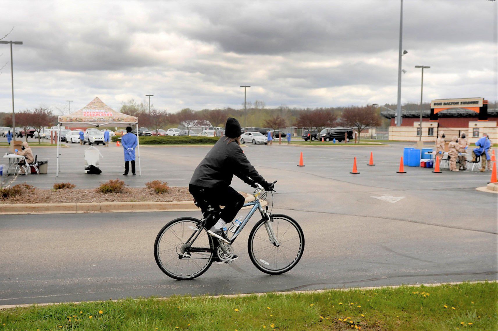 Biker rides by testing